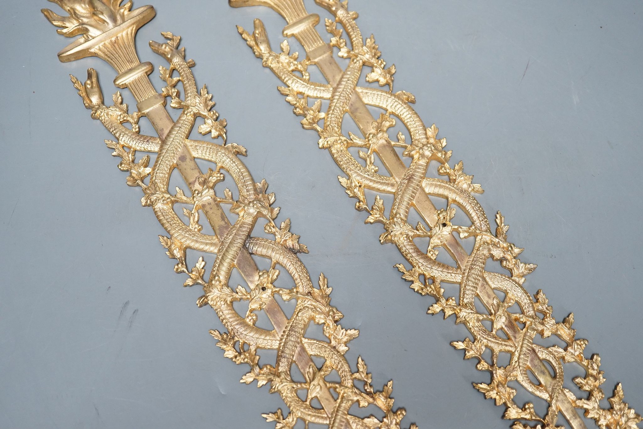A pair of ormolu furniture mounts, circa 1900, 48cm long
